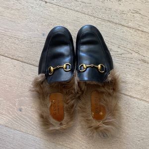 Used gucci fur slides.